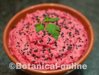 beet hummus decorated with black sesame