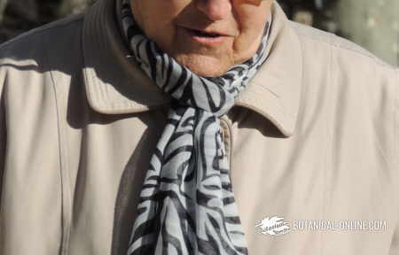 woman with a handkerchief around her throat