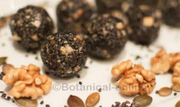 Truffles with black sesame, walnuts, pumpkin seeds and honey